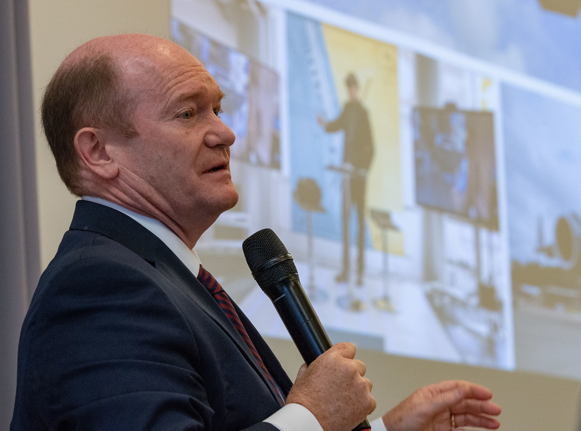 U.S. Sen. Chris Coons, addresses U.S. congressional delegates from Delaware, Central Delaware Chamber of Commerce members, local civic and business leaders and Team Dover members at the 2023 State of the Base briefing on Dover Air Force Base, Delaware, Nov. 20, 2023. The event, hosted by the CDCC, provided an opportunity to educate and inform community members and leaders on how the Dover community ties into the base's mission, vision and priorities. (U.S. Air Force photo by Roland Balik)