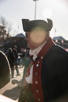 A member of the Sons of the American Revolutions waits at the staging area before the Veteran’s Day Parade in Manhattan, Kansas, Nov. 10, 2023. The 1st Inf. Div. Commanding General’s Mounted Color Guard and 1st Inf. Div. Band led Soldiers of the Big Red One as they marched along Poyntz Ave. (U.S. Army photo by Spc. Charles Leitner)