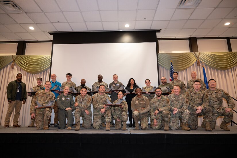 Members from the 305th Air Mobility Wing are recognized during the third quarter awards.