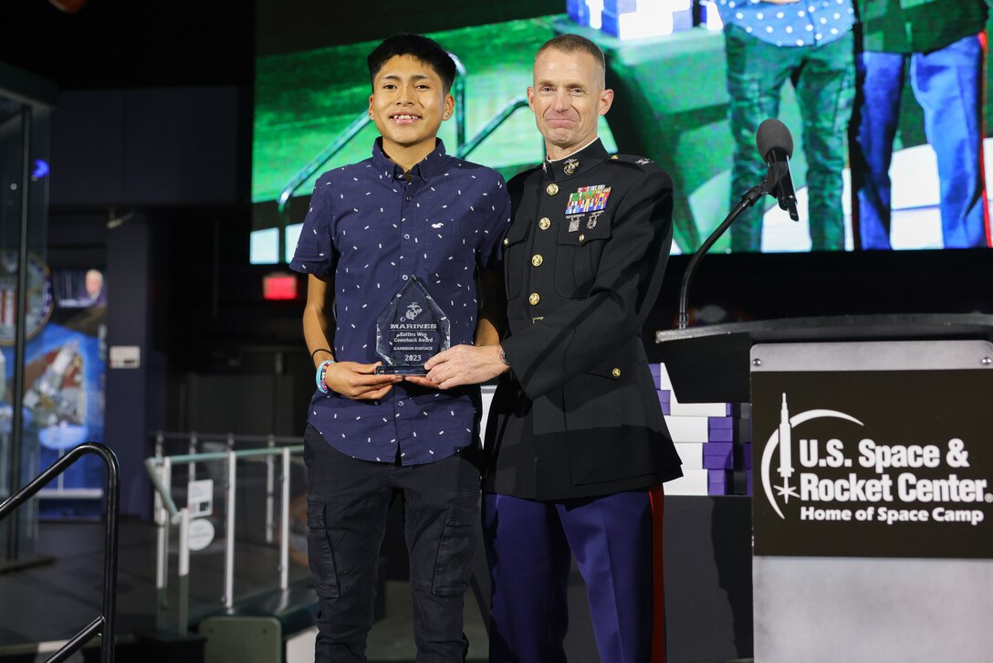 The Battles Won Comeback Award was presented to Kameron Eustace, a student of Trinidad State College and native of Zuni, New Mexico at the National Junior College Athletic Association Cross Country and Half Marathon Championships Banquet and Award Presentation in Huntsville, Al., on November 10, 2023. The Battles Won Comeback Award is presented to an athlete who overcame personal battles to compete in this years’ nationals and recognizes the mental and physical resilience to overcome obstables in order to succeed. (U.S. Marine Corps photo by Lance Cpl. Brenna Ritchie)