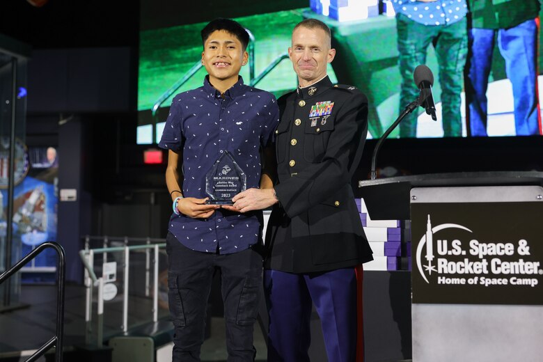 The Battles Won Comeback Award was presented to Kameron Eustace, a student of Trinidad State College and native of Zuni, New Mexico at the National Junior College Athletic Association Cross Country and Half Marathon Championships Banquet and Award Presentation in Huntsville, Al., on November 10, 2023. The Battles Won Comeback Award is presented to an athlete who overcame personal battles to compete in this years’ nationals and recognizes the mental and physical resilience to overcome obstables in order to succeed. (U.S. Marine Corps photo by Lance Cpl. Brenna Ritchie)
