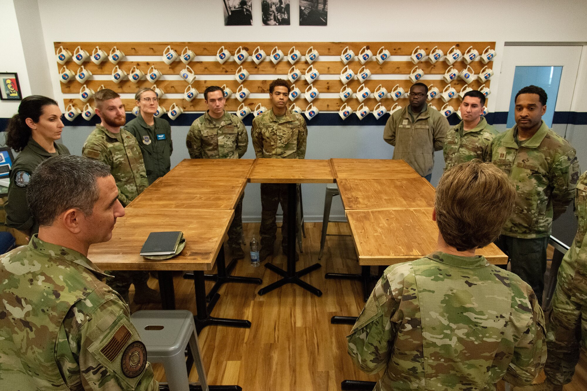 U.S. Air Force Gen. Jacqueline Van Ovost, right, U.S. Transportation Command commander, and U.S. Air Force Chief Master Sgt. Brian Kruzelnick, left, USTRANSCOM command senior enlisted leader, visit with Team Dover members inside the 9th Airlift Squadron’s heritage room at Dover Air Force Base, Delaware, Nov. 16, 2023. Van Ovost and Kruzelnick, accompanied by other leaders from TRANSCOM, visited Dover to thank Airmen for their hard work and dedication to amplifying TRANSCOM’s mission. (U.S. Air Force photo by Roland Balik)