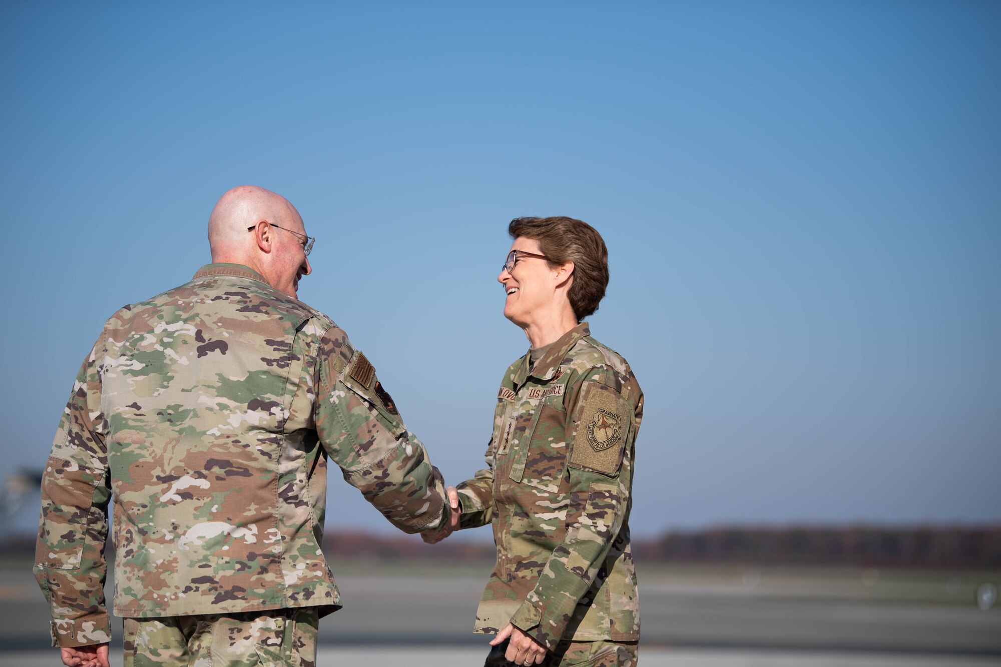 U.S. Air Force Gen. Jacqueline Van Ovost, right, U.S. Transportation Command commander, is greeted by U.S. Air Force Col. Chris McDonald, left, 436th Airlift Wing commander, at Dover Air Force Base, Delaware, Nov. 16, 2023. Van Ovost visited Dover to thank Airmen for their hard work and dedication to amplifying TRANSCOM’s mission (U.S. Air Force photo by Tech. Sgt. J.D. Strong II)