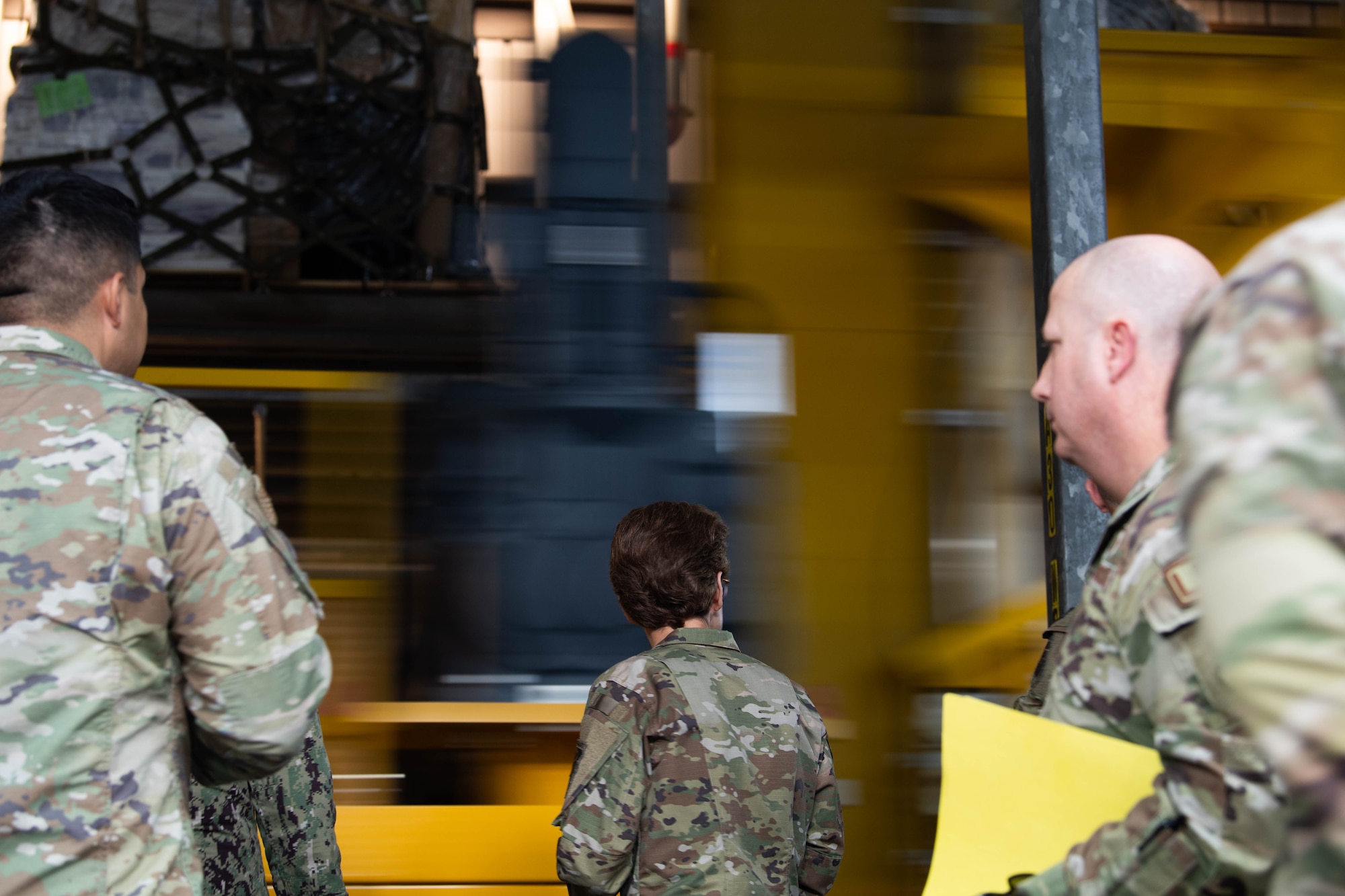 U.S. Air Force Gen. Jacqueline Van Ovost, U.S. Transportation Command commander, looks at the Mechanized Material Handling System in the 436th Aerial Port Squadron at Dover Air Force Base, Delaware, Nov. 16, 2023. Van Ovost visited Dover to thank Airmen for their hard work and dedication to amplifying TRANSCOM’s mission. (U.S. Air Force photo by Tech. Sgt. J.D. Strong II)