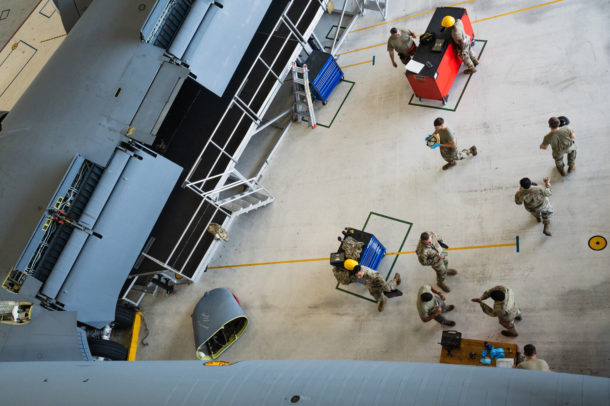 Airmen assigned to the 6th Maintenance Group perform duties inside of a hangar at MacDill Air Force Base, Florida, Nov. 21, 2023.
