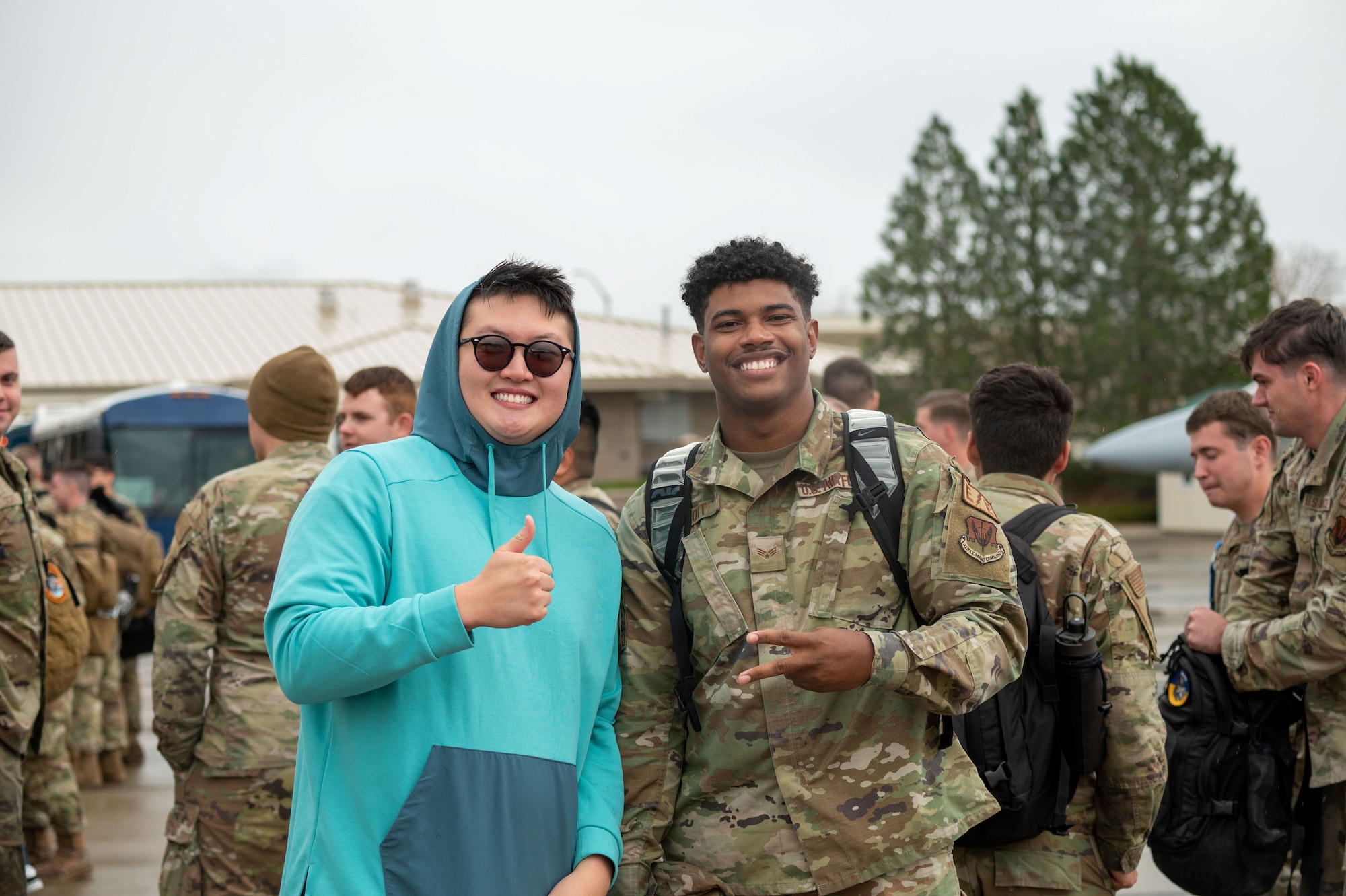 Two people pose for a photo