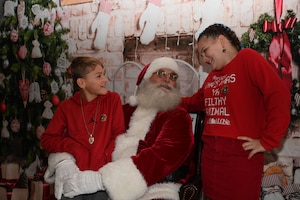 U.S. Air Force Master Sgt. Mickey Bretado, 313th Training Squadron intelligence, surveillance and reconnaissance instructor, talks about the 313th TRS’s mission during the 41st Santa’s Market at the Louis F. Garland Department of Defense Fire Academy, Goodfellow Air Force Base, Texas, Nov. 18, 2023. Santa’s Market invited the community on base to learn more about Goodfellow's mission.