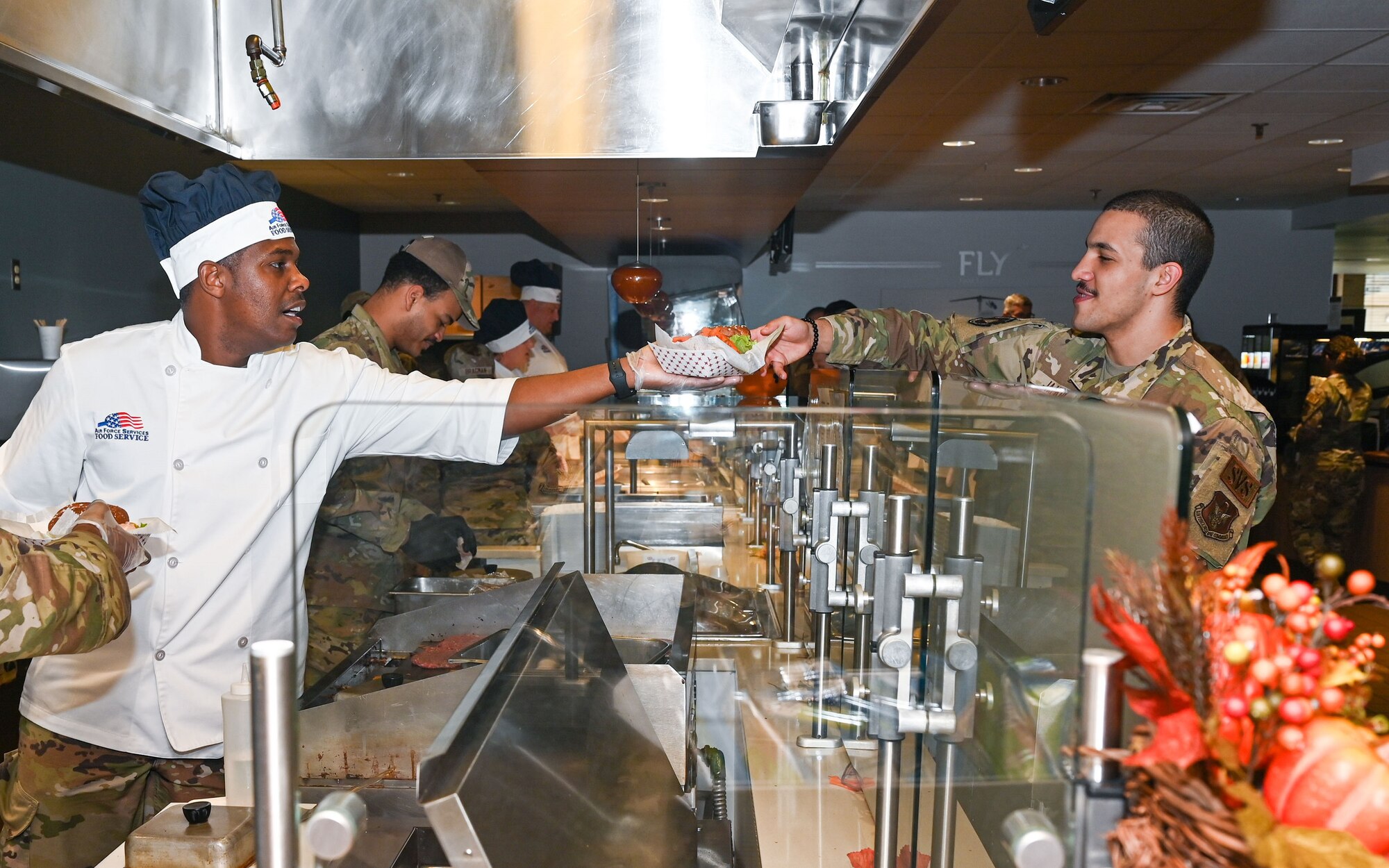 Lt. Col. Rogers hands out food