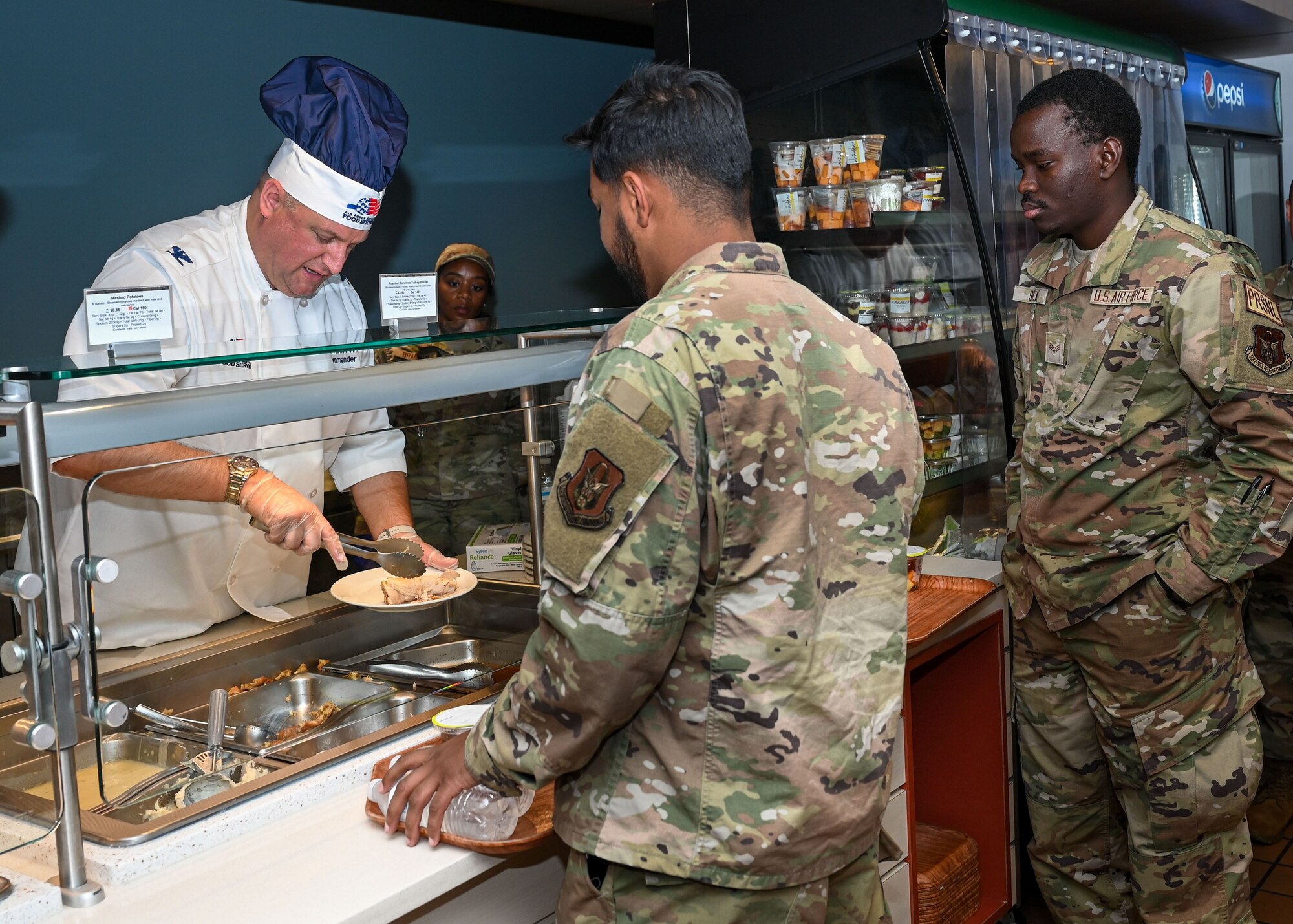 Col. Stouffer hands out food
