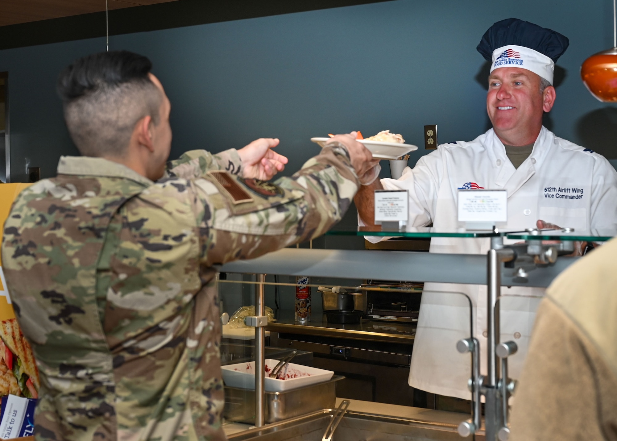 Col. Quinn hands out food