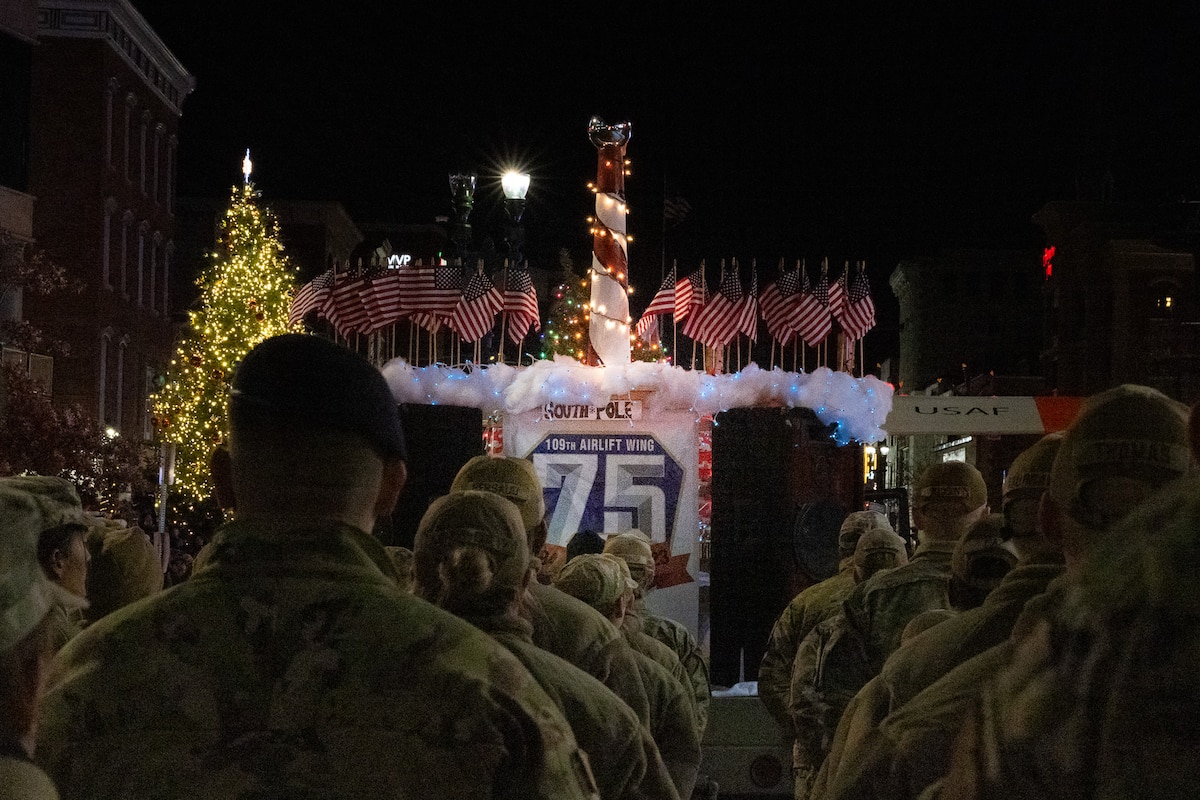 A float built and accompanied by over 50 Airmen of the 109th Airlift Wing, New York Air National Guard, navigates the route of the city of Schenectady's 2023 Holiday Parade. The wing served as grand marshal in celebration of the unit's 75th anniversary.