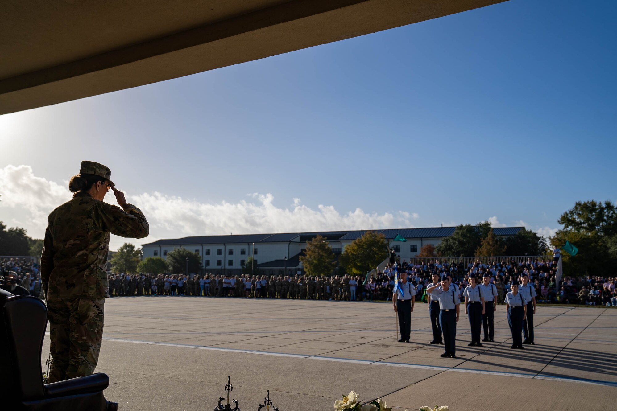 U.S. Air Force Col. Laura King, 81st Training Group commander, returns a salute to 81st TRG Airmen as they begin their regulation drill demonstration at the Fourth Quarter Drill Down competition on the Levitow Training Support Facility drill pad on Keesler Air Force Base, Mississippi, Oct. 27, 2023.