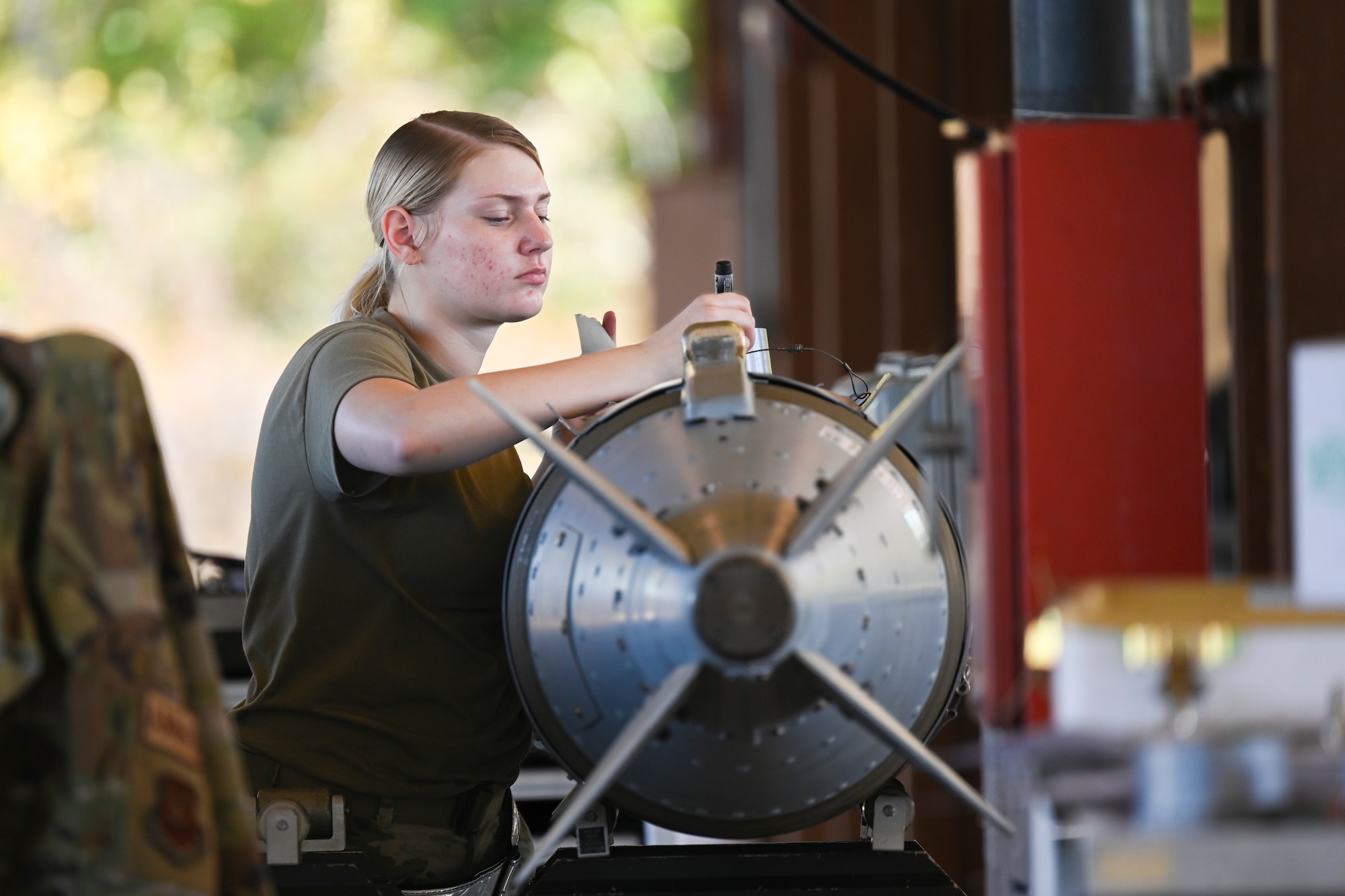 Airman 1st Class Mary Garrison, 2nd Munitions Squadron conventional maintenance technician, assembles a GBU-31 munition during a Combat Ammunition Production Exercise Nov. 7, 2023 at Barksdale Air Force Base, La. CAPEX is designed to prepare munitions Airmen for future deployments and home station contingency taskings by simulating sustained combat operations. (U.S. Air Force Photo by Senior Airman Nia Jacobs)