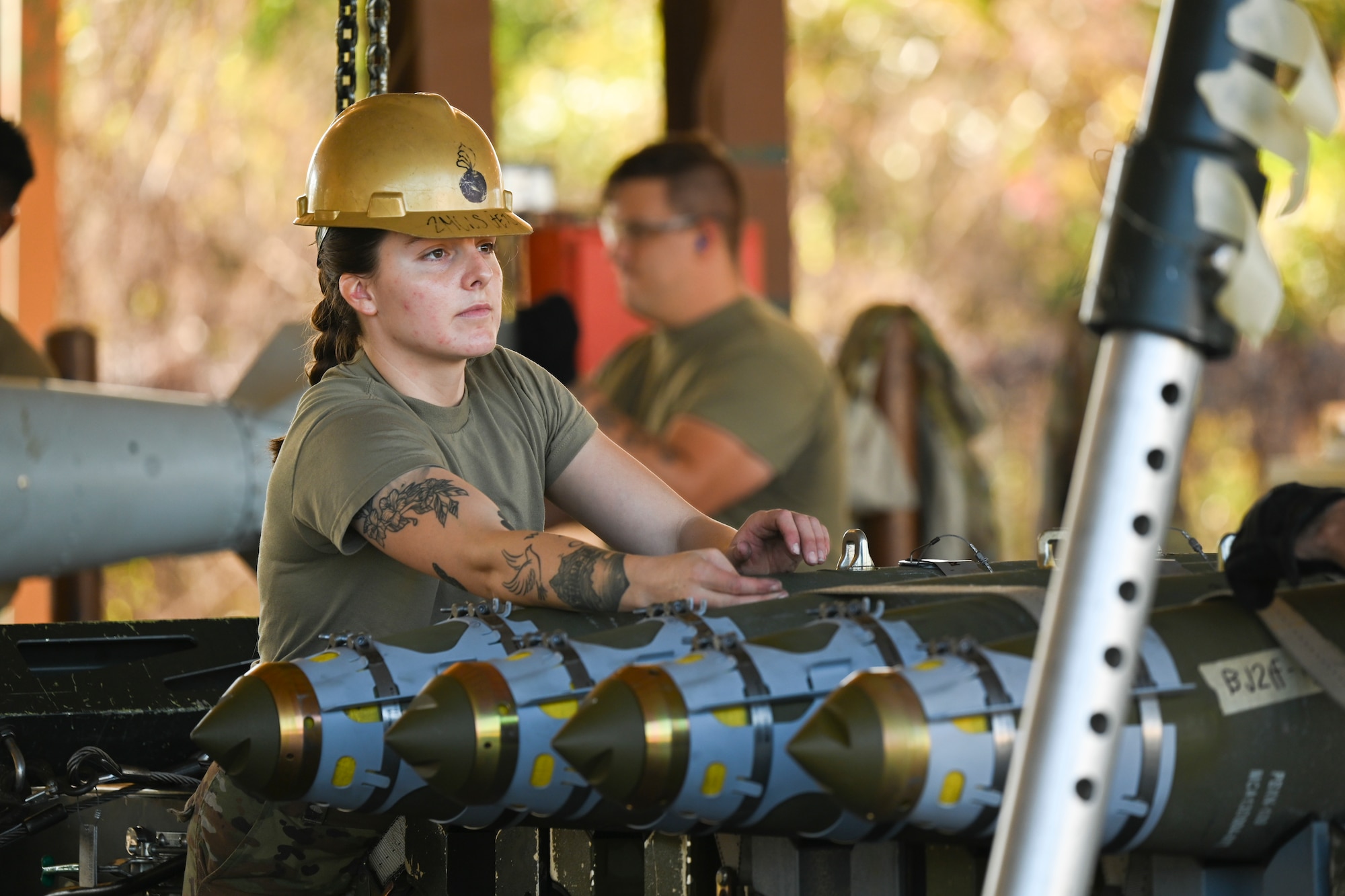 Staff Sgt. Kayla Satcher, 2nd Munitions Squadron conventional maintenance inspector, loads a trailer with GBU-38 munitions during a Combat Ammunition Production Exercise Nov. 7, 2023 at Barksdale Air Force Base, La. CAPEX is designed to prepare munitions Airmen for future deployments and home station contingency taskings by simulating sustained combat operations. (U.S. Air Force Photo by Senior Airman Nia Jacobs)