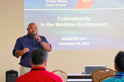 Jon Chargualaf discusses cybersecurity with participants of the U.S. Coast Guard Forces Micronesia/Sector Guam hosted second annual Industry Day on Nov. 20, 2023, in Guam. Following the success of the inaugural session in 2022, this event further strengthened the collaboration between the U.S. Coast Guard and the maritime industry. The day's agenda included insightful presentations and discussions led by U.S. Coast Guard officials and industry experts. Topics ranged from domestic vessel inspection and maritime cybersecurity to modernization updates from the Port of Guam. This Industry Day is significant for the U.S. Coast Guard and the maritime industry. It provides a unique platform for a mutual exchange of ideas and challenges, helping to build a stronger, more informed maritime community. (U.S. Coast Guard photo by Chief Warrant Officer Sara Muir)