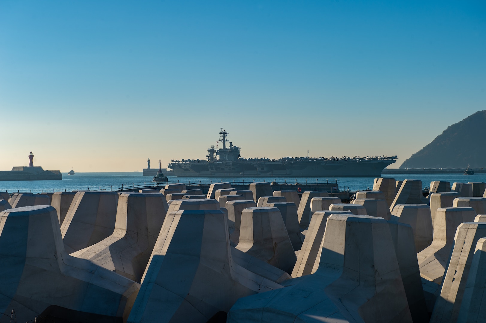 BUSAN, REPUBLIC OF KOREA (Nov. 21, 2023) Nimitz-class aircraft carrier USS Carl Vinson (CVN 70) pulls into Busan, Republic of Korea for a scheduled port visit. Vinson, the flagship of Carrier Strike Group ONE, is deployed to the U.S. 7th Fleet area of operations in support of a free and open Indo-Pacific.