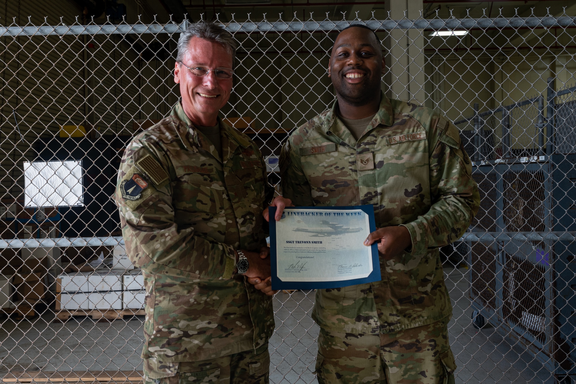 Photo of an Airman receiving the Linebacker of the Week Award