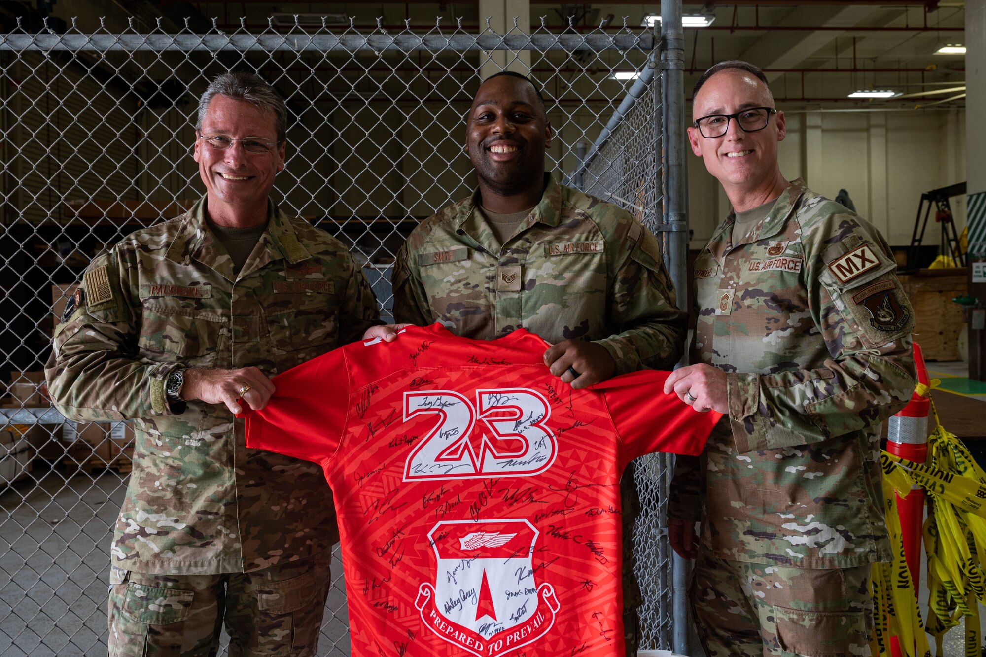 Photo of an Airman receiving the Linebacker of the Week Award