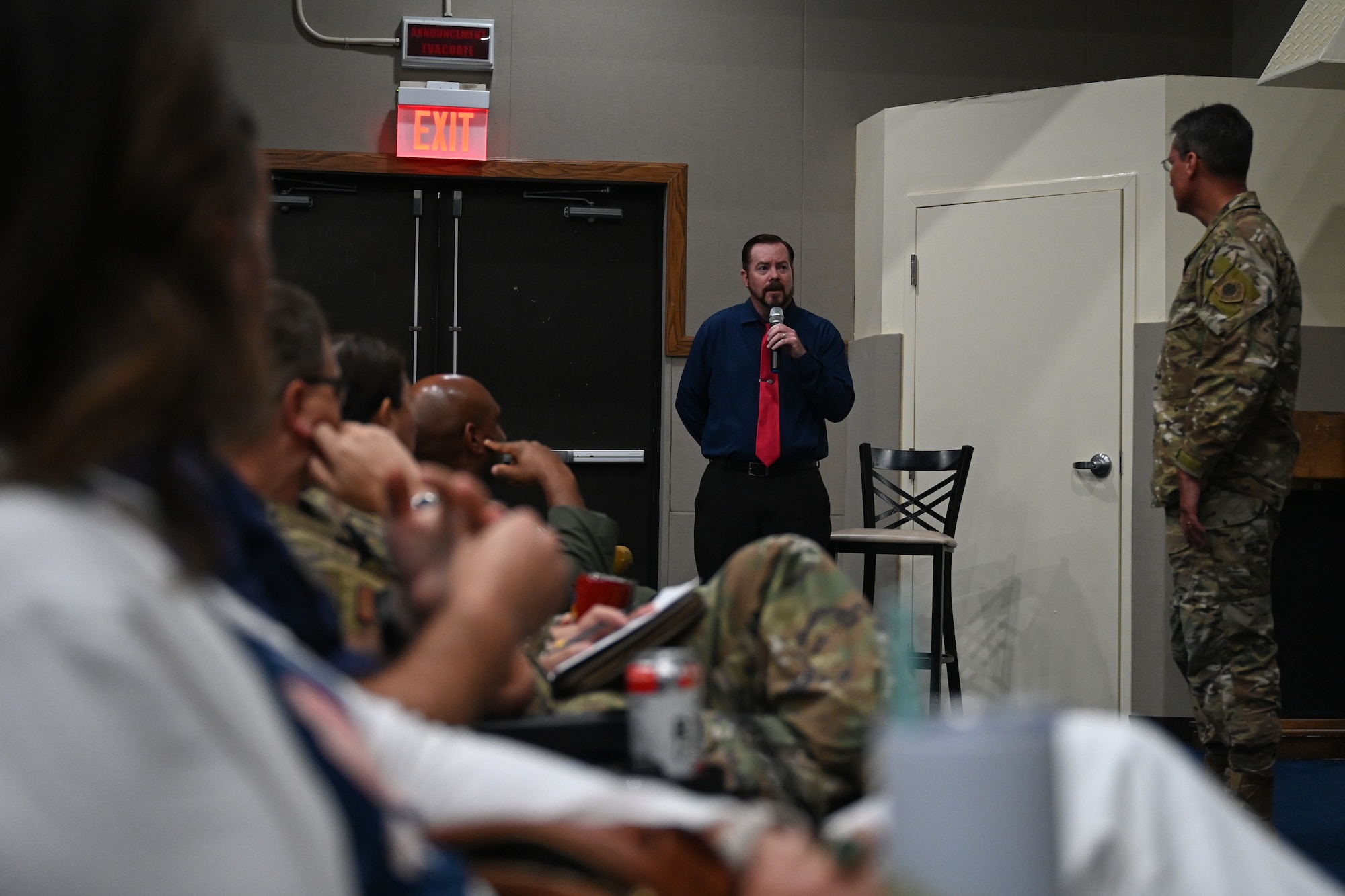 George McNamara, Defense Army and Air Force Exchange Services general manager for Guam and Saipan, answers questions during a townhall event at Andersen Air Force Base, Guam, Nov. 17, 2023.