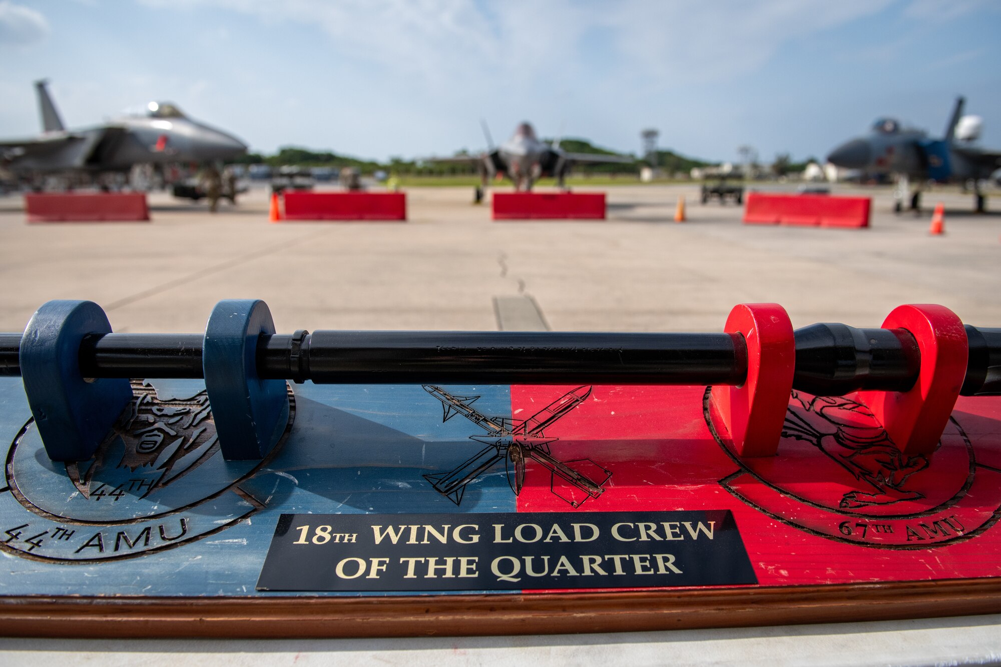 The 18th Wing Load Crew of the Quarter trophy awaits its newest keeper prior to a weapons load competition at Kadena Air Base, Japan, Nov. 17, 2023. The competition pitted Active Duty and Air National Guard Airmen from three squadrons against each other to determine the finest weapons load team at the Keystone of the Pacific. (U.S. Air Force Photo by Lt. Col. Raymond Geoffroy)