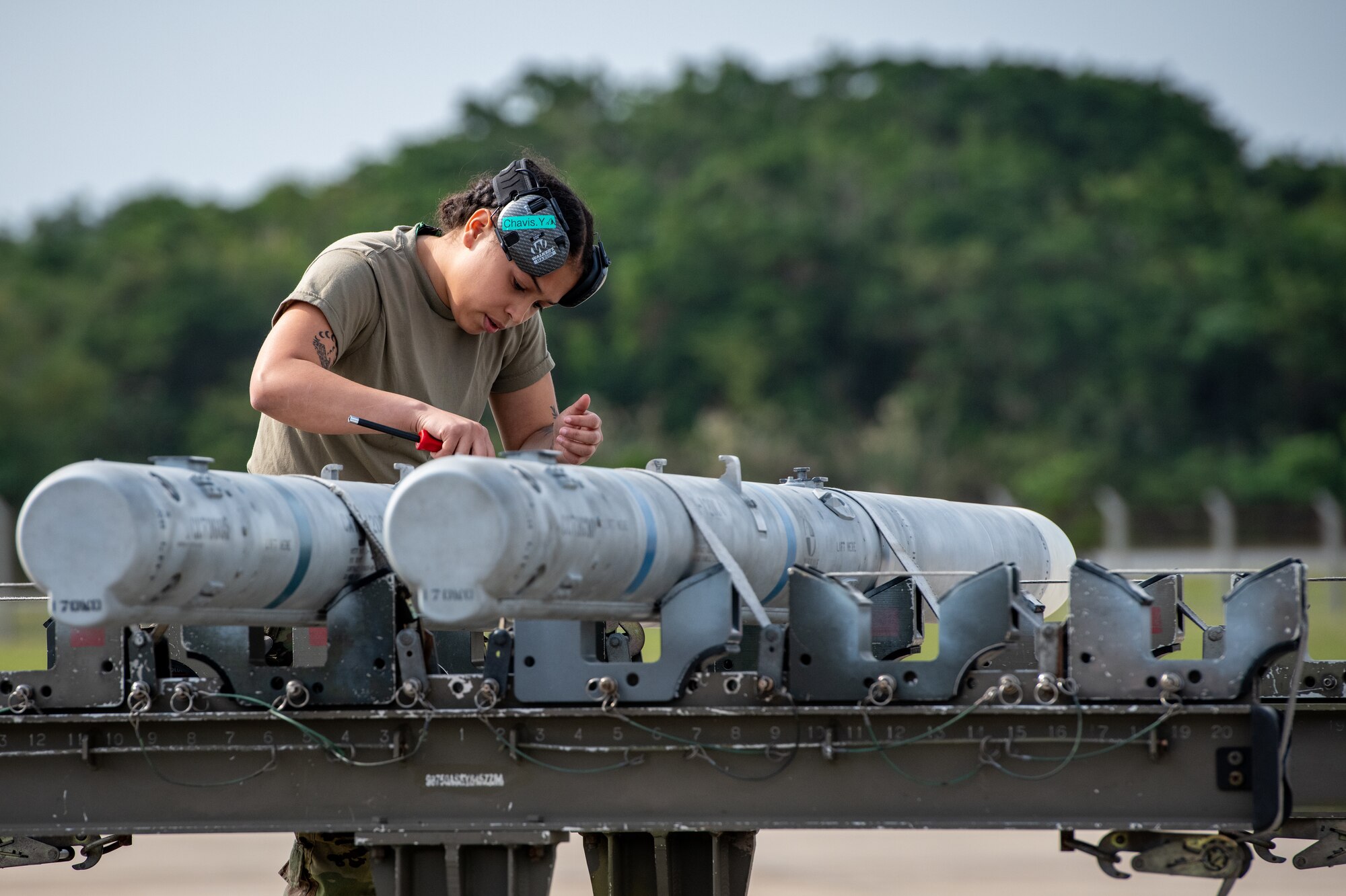An Airman from the 356th Fighter Generation Squadron prepares an AIM-120 Advanced Medium Range Air-to-Air Missile to be loaded onto an F-35A Lightning II during a weapons load competition at Kadena Air Base, Japan, Nov. 17, 2023. The 356th FGS is deployed to Kadena to support deployed F-35As that are maintaining U.S. fifth-generation fighter presence in and around Japan’s south-west islands. (U.S. Air Force Photo by Lt. Col. Raymond Geoffroy)