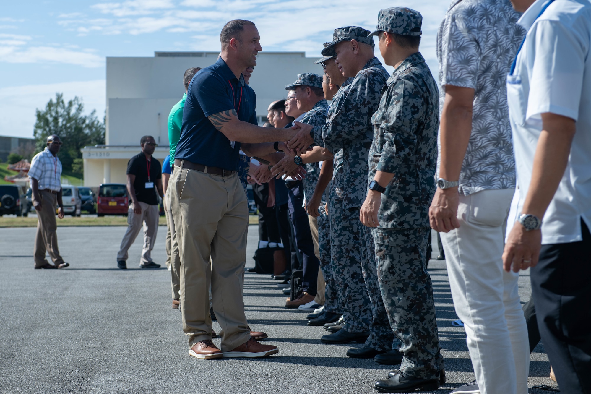 Command Chief Wolfgang shaking hands with JASDF members