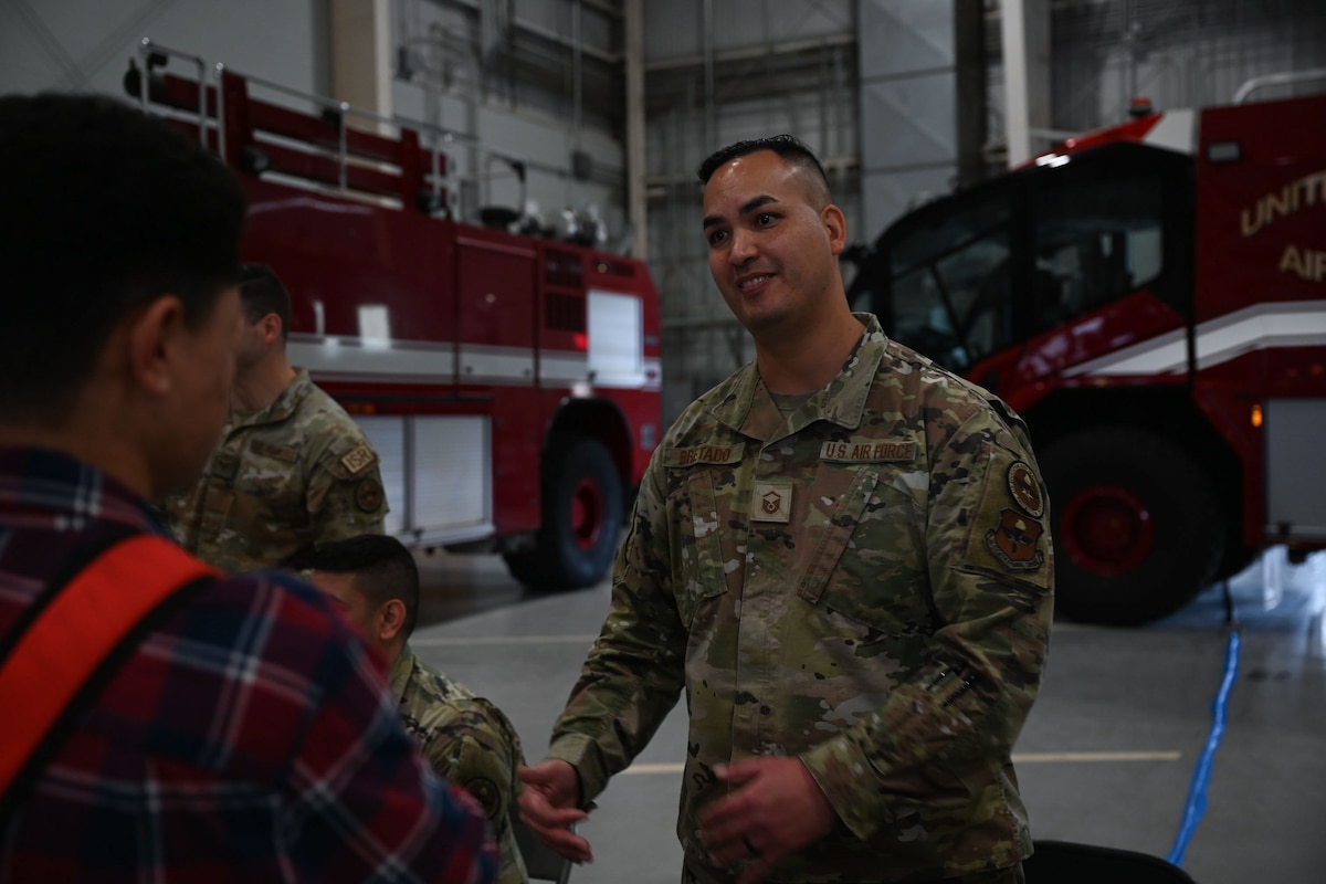 U.S. Air Force Master Sgt. Mickey Bretado, 313th Training Squadron intelligence, surveillance and reconnaissance instructor, talks about the 313th TRS’s mission during the 41st Santa’s Market at the Louis F. Garland Department of Defense Fire Academy, Goodfellow Air Force Base, Texas, Nov. 18, 2023. Santa’s Market invited the community on base to learn more about Goodfellow's mission.