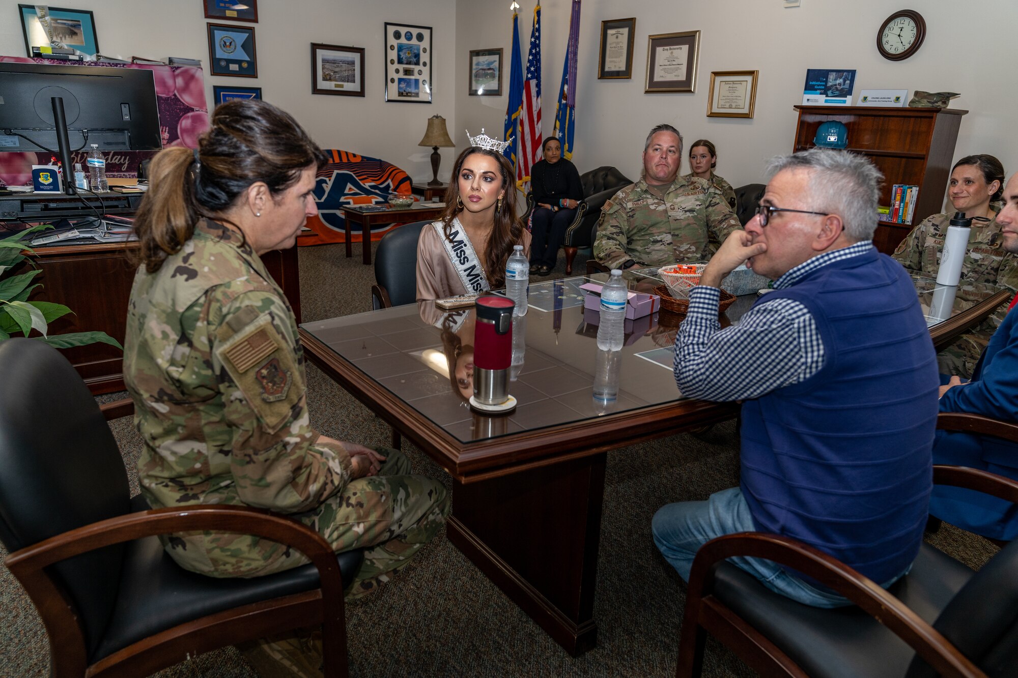 Vivian O’Neal, Miss Mississippi 2023, and her father, Dr. Anthony O’Neal, speak with U.S. Air Force Col. Laura King, 81st Training Group commander, during their tour at Keesler Air Force Base, Mississippi, Nov. 20, 2023.