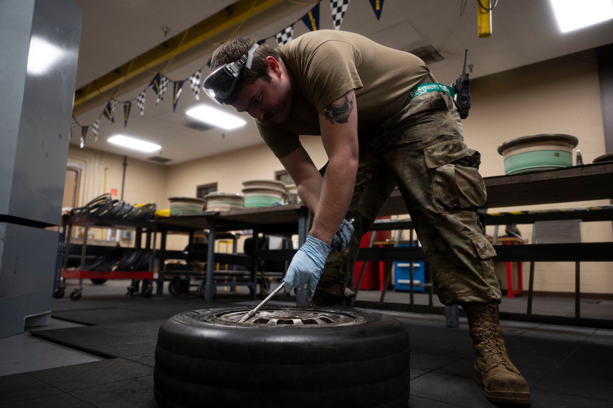 U.S. Air Force Senior Airman Tyler White, 49th Equipment Maintenance Squadron crash recovery journeyman, breaks down a wheel of an F-16 Viper at Holloman Air Force Base, New Mexico, Nov. 20, 2023. The 49th EMS crash recovery team specializes in the challenging task of recovering damaged aircraft, expertly performing sortie generation and ground handling operations, and conducting thorough inspections to assess and address the specific needs of each compromised aircraft. (U.S. Air Force photo by Airman 1st Class Isaiah Pedrazzini)