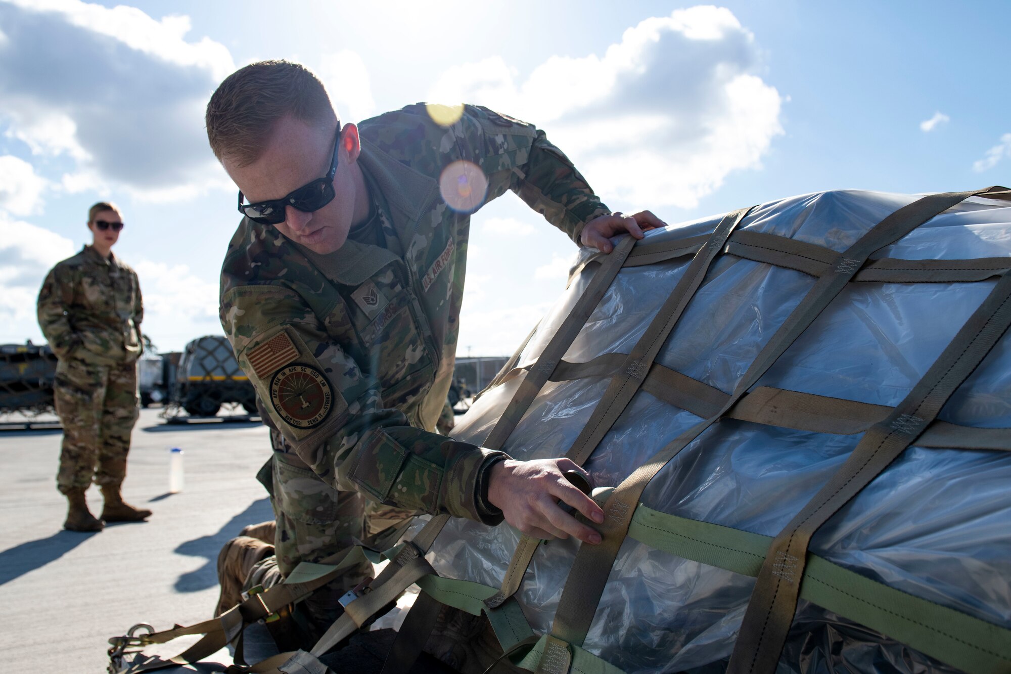 A photo of Airmen palatizing gear for deployment