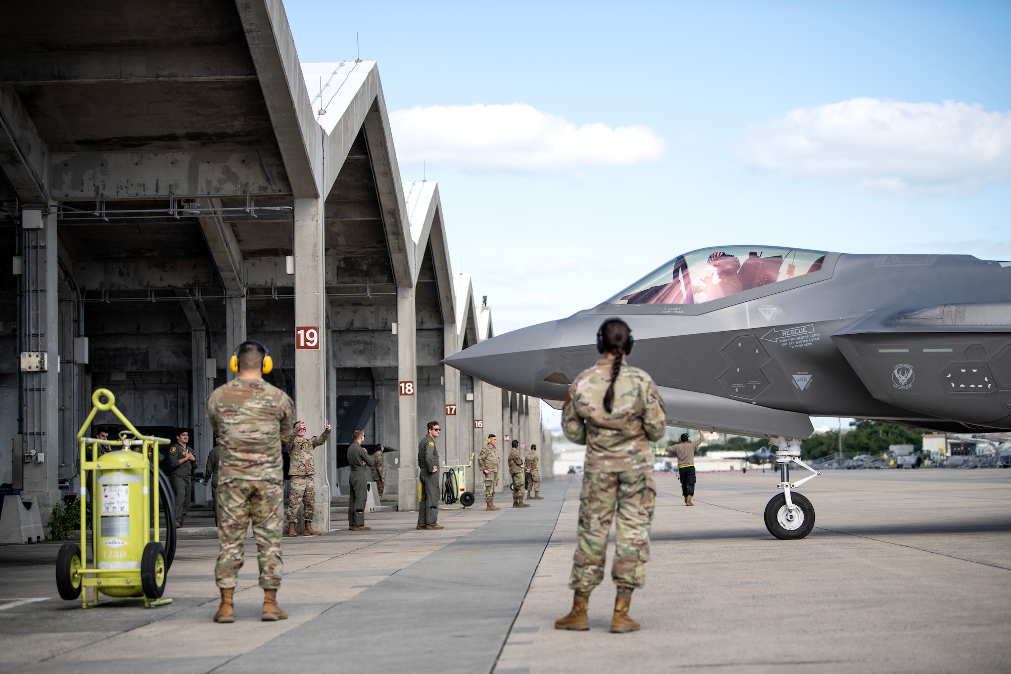 U.S. Air Force Airmen from Hill Air Force Base, Utah, greet one of their F-35A Lightning II pilots as he arrives at Kadena Air Base, Japan, Nov. 20, 2023. The 4th FS will be joining the 356th Fighter Squadron from Eielson AFB, Alaska, in providing forward-deployed, fifth-generation fighter capabilities to assure allies and deter threats in the Indo-Pacific region. (U.S. Air Force photo by Staff Sgt. Jessi Roth)