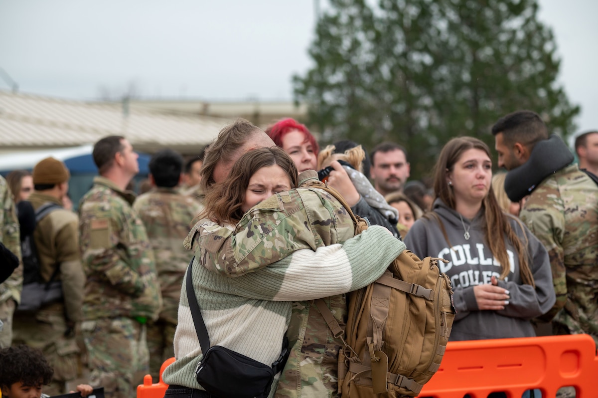 Airmen hugs his wife