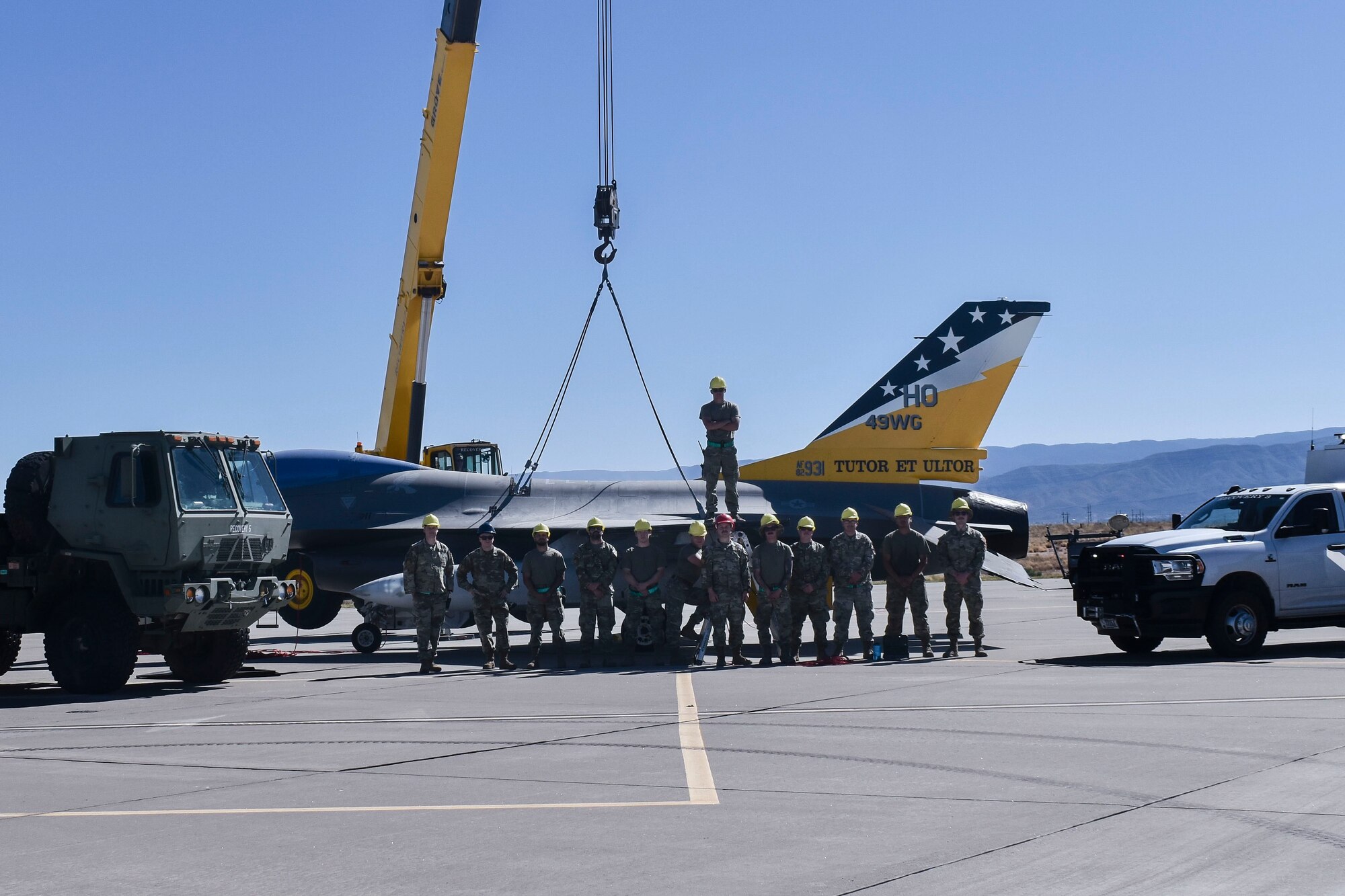 Airmen from the 49th Equipment Maintenance Squadron crash recovery team pose for a photo during a training exercise at Holloman Air Force Base, New Mexico, Jun. 6, 2023. The team’s proficiency is an extension of the sound communication between the supervisors and the Airmen, which demonstrates their prowess in leading and developing Airmen. (Courtesy photo)