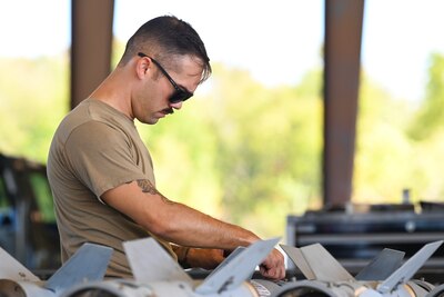 Tech. Sgt. Matthew Kirshner, 2nd Munitions Squadron conventional maintenance production superintendent, assembles GBU-54 munitions during a Combat Ammunition Production Exercise Nov. 7, 2023 at Barksdale Air Force Base, La. CAPEX is designed to prepare munitions Airmen for future deployments and home station contingency taskings by simulating sustained combat operations. (U.S. Air Force Photo by Senior Airman Nia Jacobs)