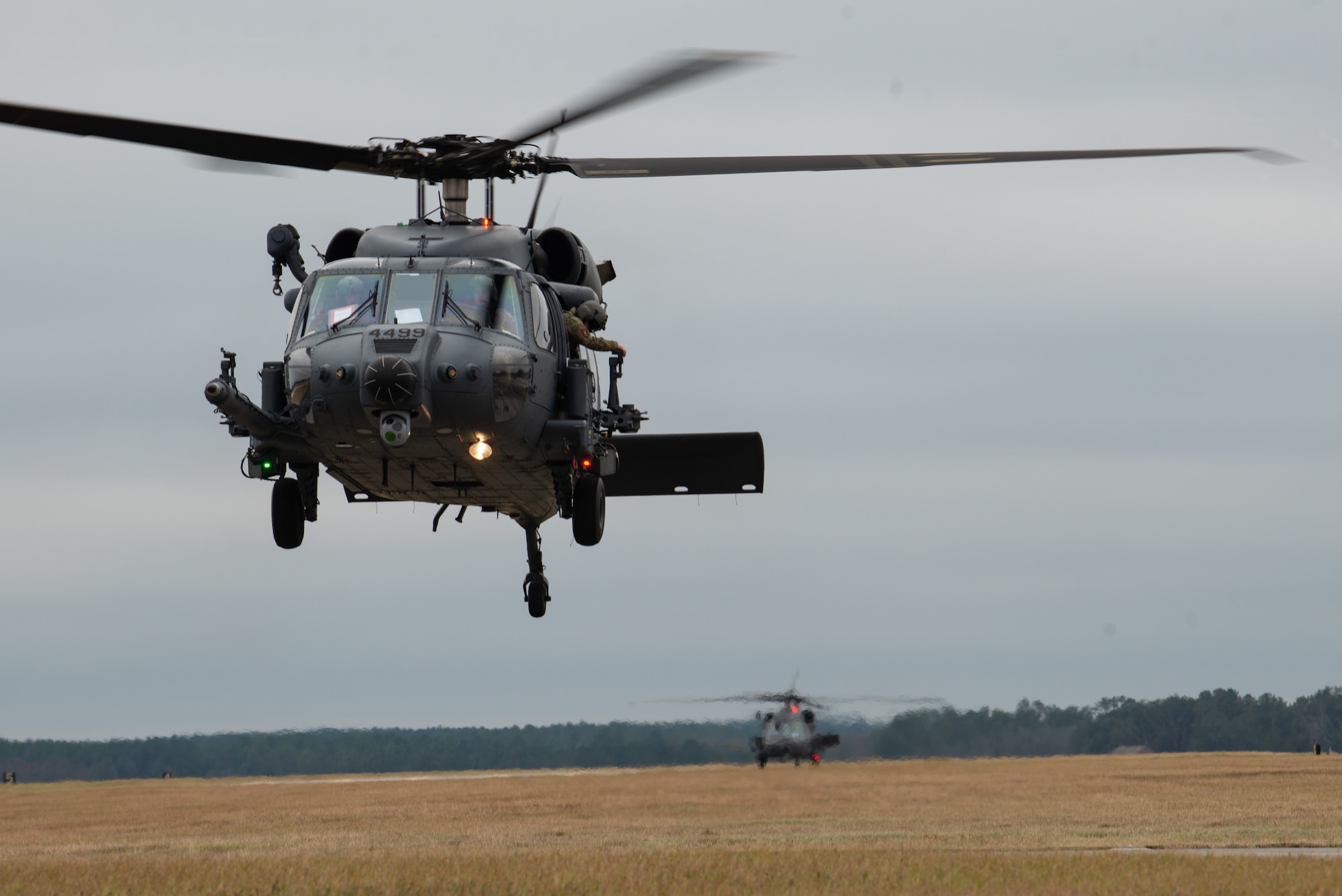 An HH-60W Jolly Green II, assigned to the 41st Rescue Squadron takes off during Mosaic Tiger 24-1 at Moody Air Force Base, Georgia, Nov. 13, 2023. Adaptability and responsiveness are key to the rescue community, and aircrew train expeditiously to support the combat airpower mission. (U.S. Air Force photo by Staff Sgt. John Crampton)