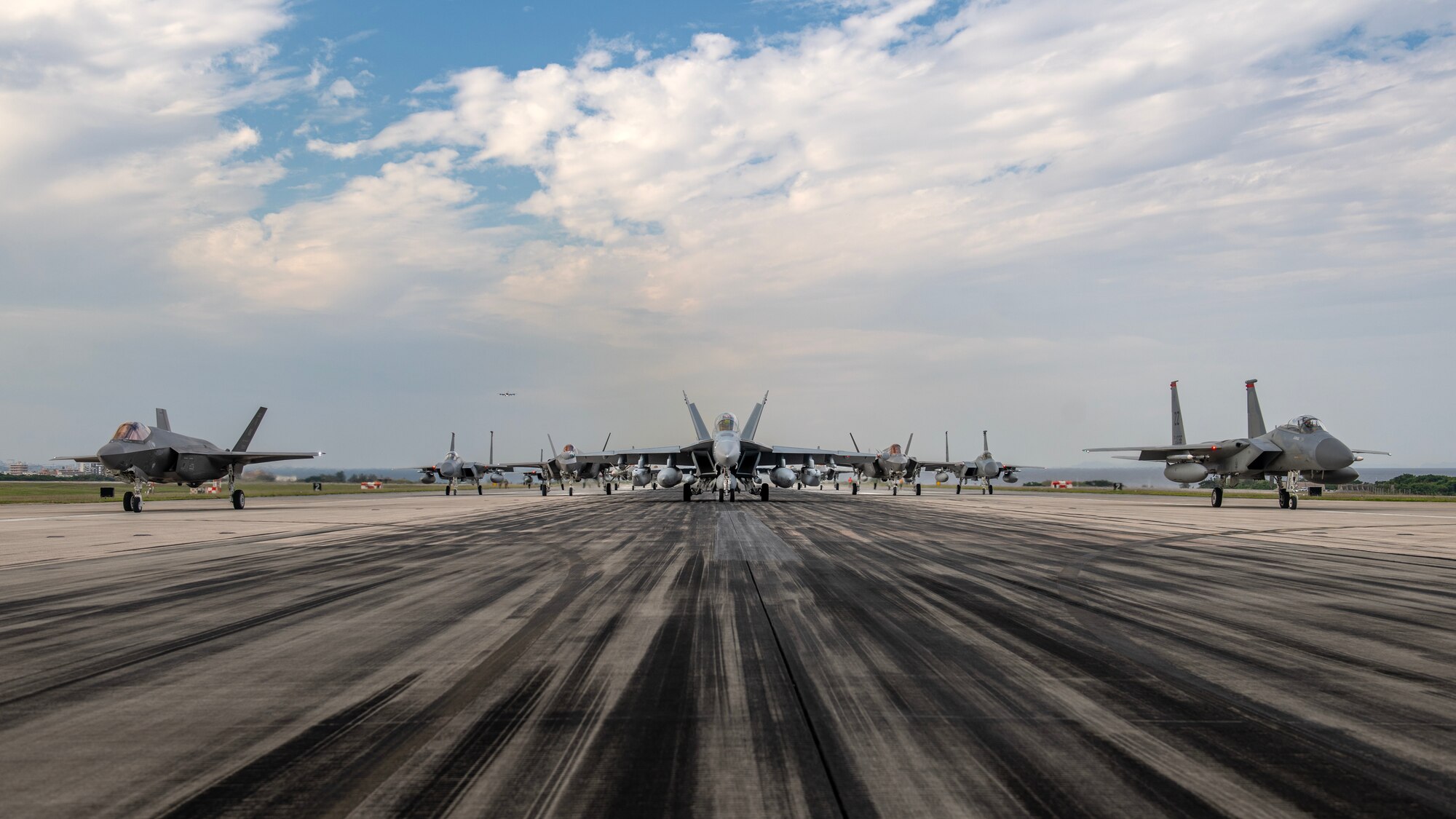 U.S. military aircraft line up on the runway during an elephant walk at Kadena Air Base, Japan, Nov. 21, 2023. Kadena’s ability to rapidly generate U.S. airpower is a vital function of its mission to ensure the stability and security of the Indo-Pacific region. (U.S. Air Force photo by Staff Sgt. Roth)