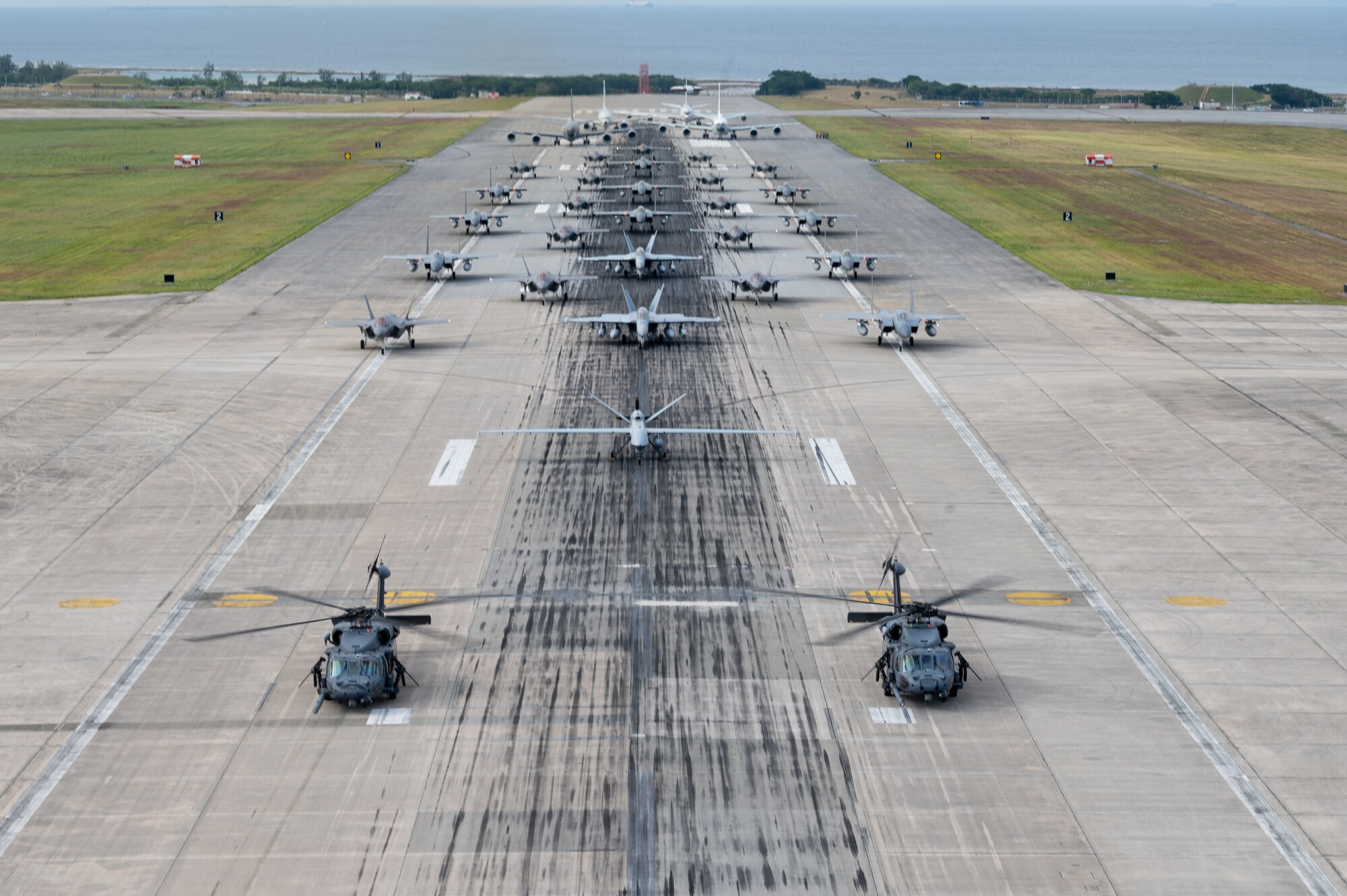 U.S. Air Force and U.S. Navy Aircraft form up on the runway