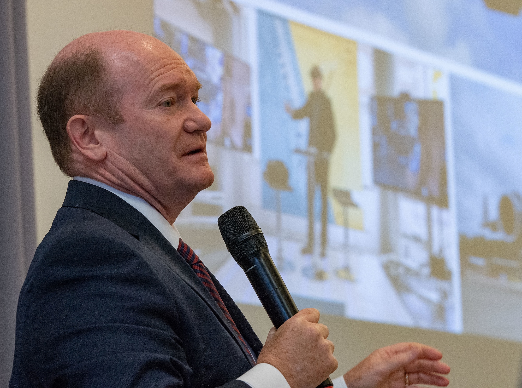 U.S. Sen. Chris Coons, addresses U.S. congressional delegates from Delaware, Central Delaware Chamber of Commerce members, local civic and business leaders and Team Dover members at the 2023 State of the Base briefing on Dover Air Force Base, Delaware, Nov. 20, 2023. The event, hosted by the CDCC, provided an opportunity to educate and inform community members and leaders on how the Dover community ties into the base's mission, vision and priorities. (U.S. Air Force photo by Roland Balik)