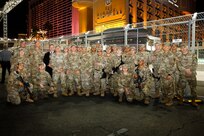 Members of the 72nd Military Police Company, Nevada National Guard, pose for a photo with state command leaders in Las Vegas Nov. 17, 2023. The 72nd MPs enhanced security at the Las Vegas Strip for the Formula 1 Grand Prix.