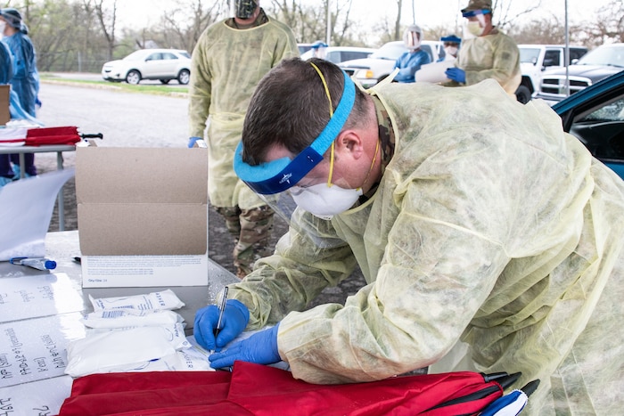 Missouri Air National Guard assists local agencies in providing drive-in COVID-19 screenings. (U.S. Air National Guard photo by Tech. Sgt. Patrick Evenson)