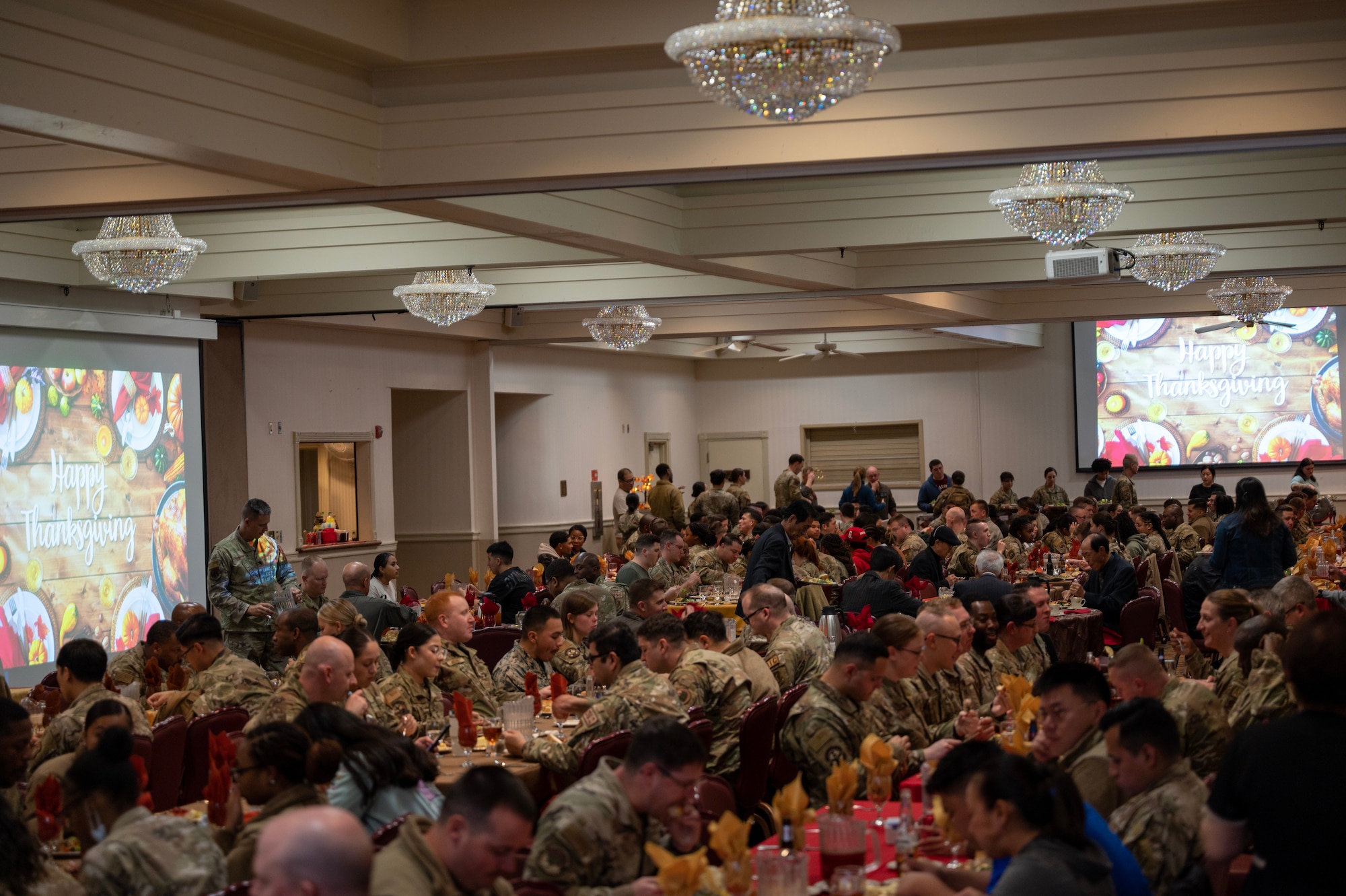 U.S. service members assigned to Kunsan Air Base, Republic of Korea, dine during the annual Thanksgiving meal hosted by the Korean-American Gunsan Alliance.