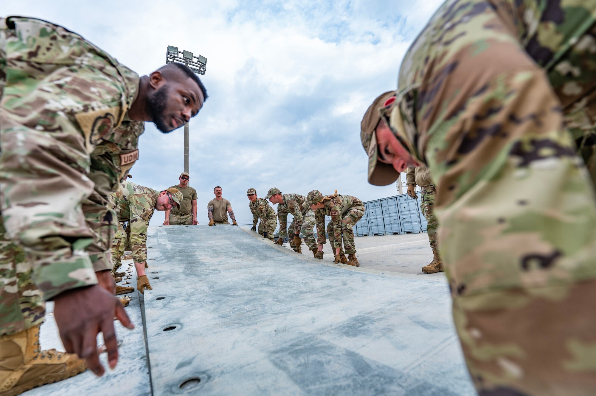Airmen from the 8th Civil Engineer Squadron assemble fiberglass reinforcement polymer mat during a Prime Base Engineer Emergency Force or “Prime BEEF” training at Kunsan Air Base.