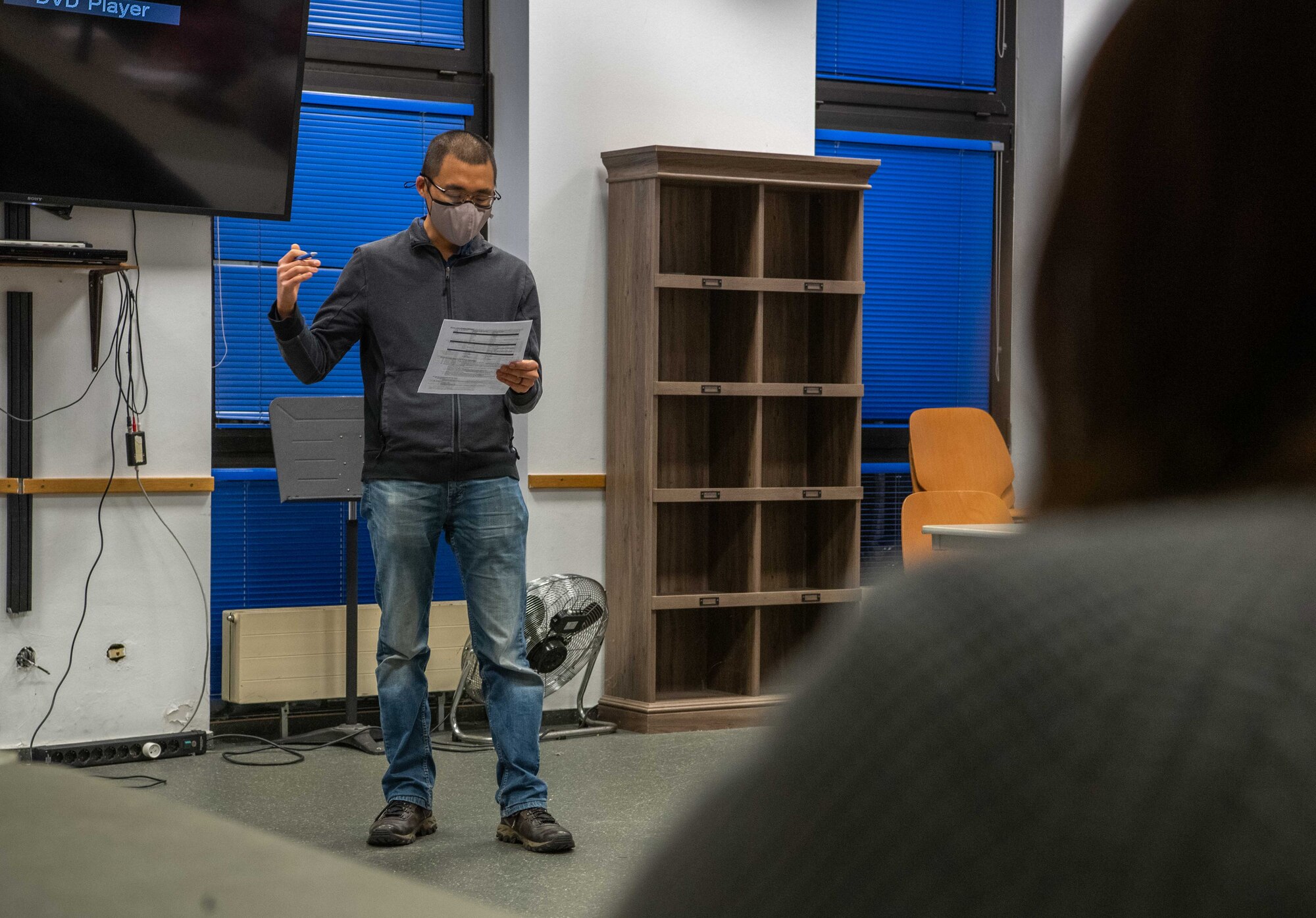 A man stands in front of an audience