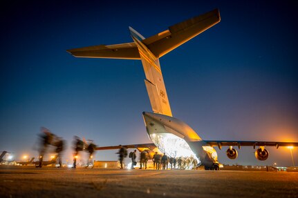 U.S. Army Soldiers assigned to the 2nd Infantry Brigade Combat Team (Airborne), 11th Airborne Division, exit a C-17 Globemaster III during Joint Pacific Multinational Readiness Center 24-1 at March Air Reserve Base, California, Oct. 28, 2023. JPMRC 24-1 included over 5,300 participants from the U.S. Joint Force, New Zealand, the United Kingdom, Indonesia and Thailand.
