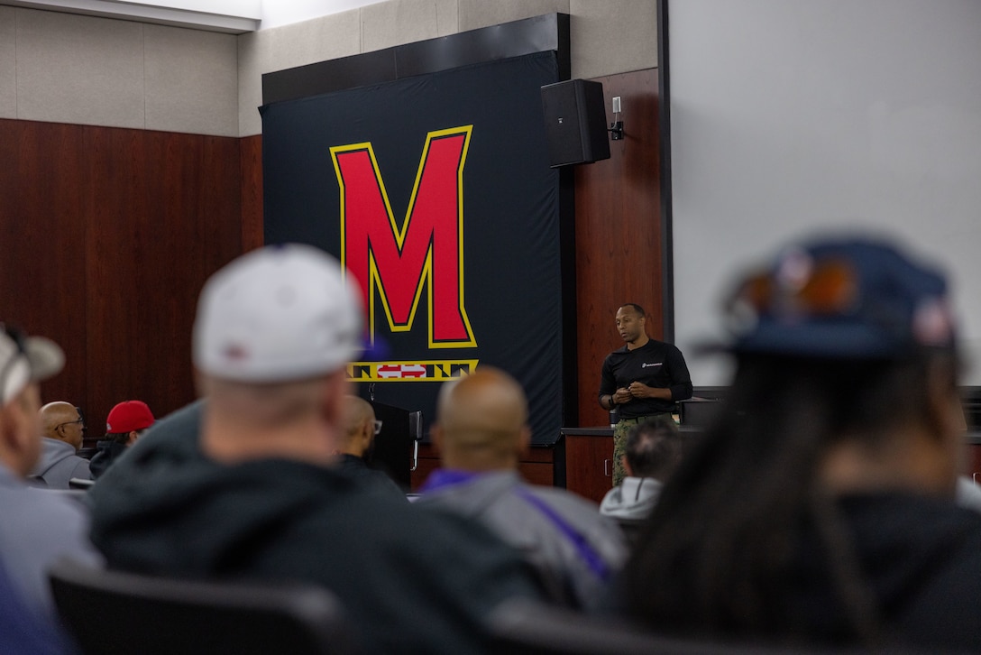 U.S. Marine Corps Capt. Aaron Webster, the national partnerships action officer with Marine Corps Recruiting Command, speaks to coaches during the American Baseball Coaches Association clinic, on the campus of the University of Maryland - College Park, on Nov. 11, 2023. The Marine Corps National Partnerships ensure the coaches of the next generation of Marines have the resources and skills to accurately present the Marine Corps as an option to their athletes, and support recruiter access to prospective audiences. (U.S. Marine Corps Photo by Lance Cpl. Payton Goodrich)