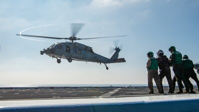 HSC-23 lands aboard USS Somerset (LPD 25) during flight quarters in the Pacific Ocean.