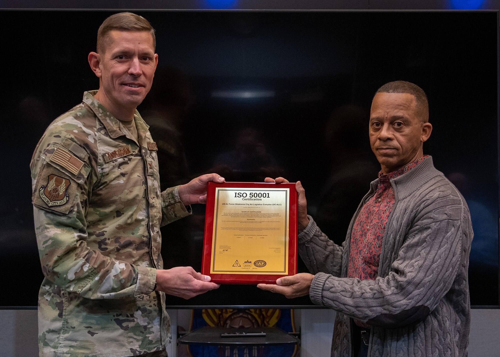 people stand with award