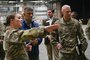 Maj. Lacey Koelling, 2nd Maintenance Squadron commander, briefs Ashish S. Vazirani, acting Under Secretary of Defense for Personnel and Readiness, during a visit to the Corrosion Control Facility at Barksdale Air Force Base, Louisiana, Nov. 14, 2023. Vazirani serves as the serves as the principal staff assistant and advisor to the Secretary of Defense for force readiness; force management; health affairs; National Guard and Reserve component affairs; education and training; and military and civilian personnel requirements and management, including equal opportunity, morale, welfare, recreation, and quality of life matters. (U.S. Air Force photo by Senior Airman Nia Jacobs)