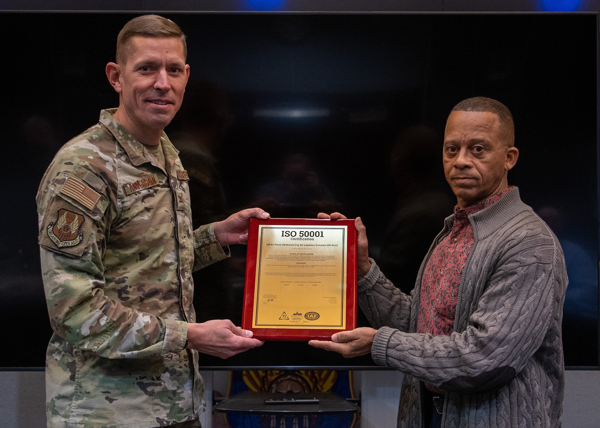 people stand with award