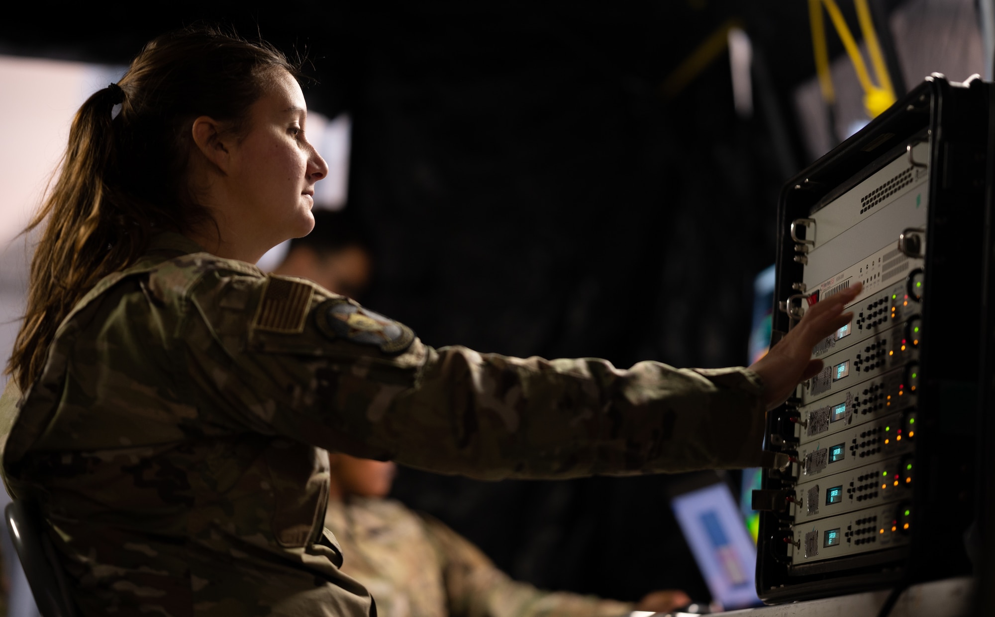 U.S. Air Force Tech. Sgt. Shannon Robertson, 26th Space Aggressor Squadron non-commissioned officer in-charge of electronic warfare plans, powers on a red electromagnetic attack during Exercise HEAVY RAIN 23, Nov. 16, 2023 at Ramstein Air Base, Germany. HEAVY RAIN is a U.S. Air Forces in Europe-led command and control exercise that tests and evaluates communication and data-sharing capabilities among the joint force, NATO Allies and partners. (U.S. Air Force Photo by Senior Airman Edgar Grimaldo